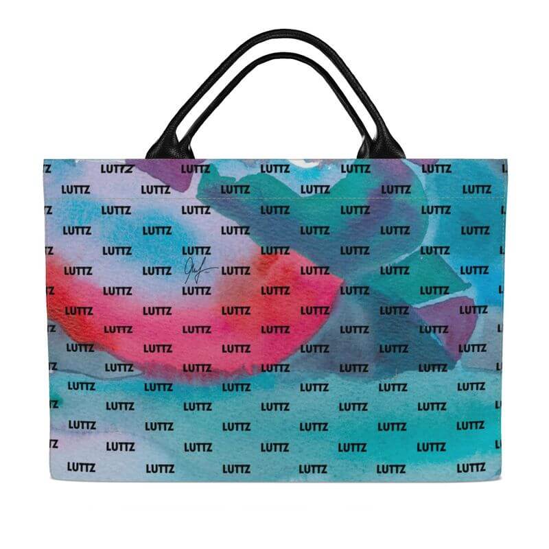 Brightly colored luxury bag from LUTTZ with unique Mediterranean fabric design, inspired by the south of France.