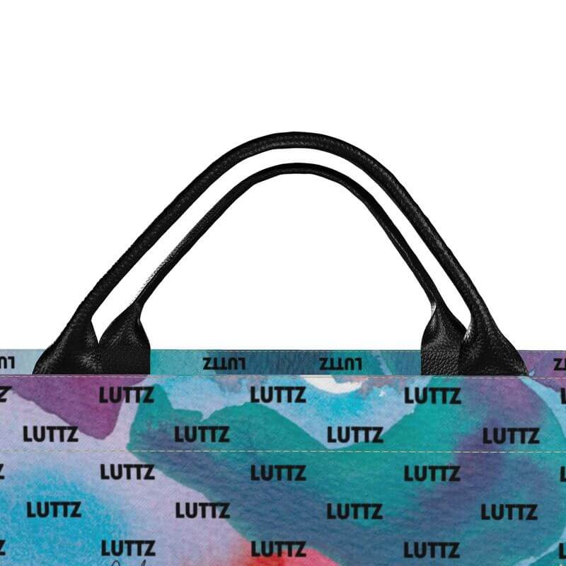 Luxury unique designer bag from LUTTZ with abstract Mediterranean fabric design and leather handles.