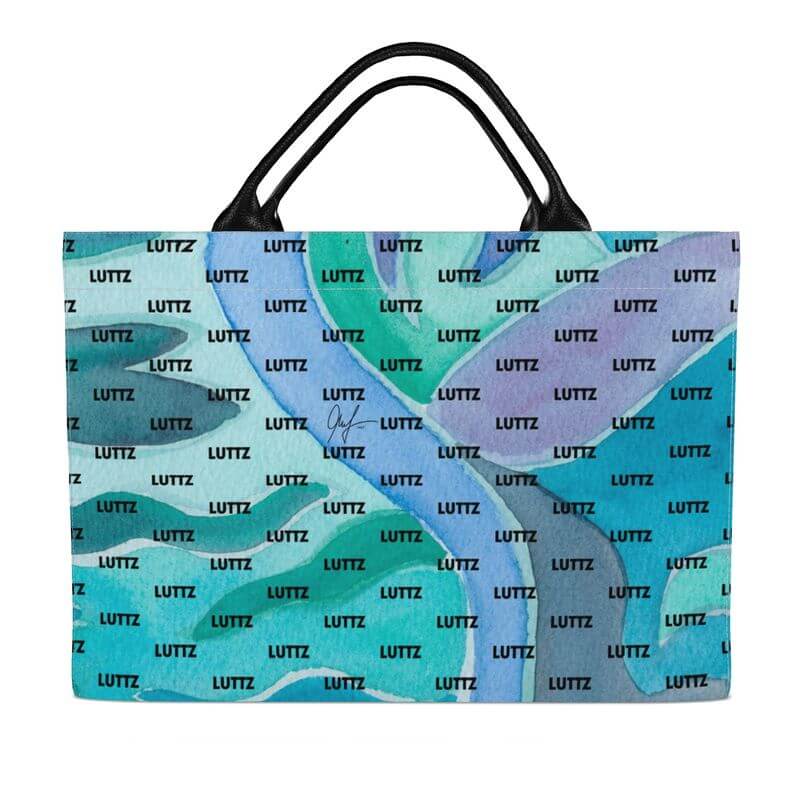 Colorful LUTTZ bag with Mediterranean fabric design, a luxury designer piece inspired by the south of France.