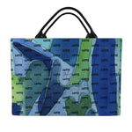 Colorful luxury DEEP WATER bag by LUTTZ, featuring unique Mediterranean fabric design and leather handles, inspired by South of France.