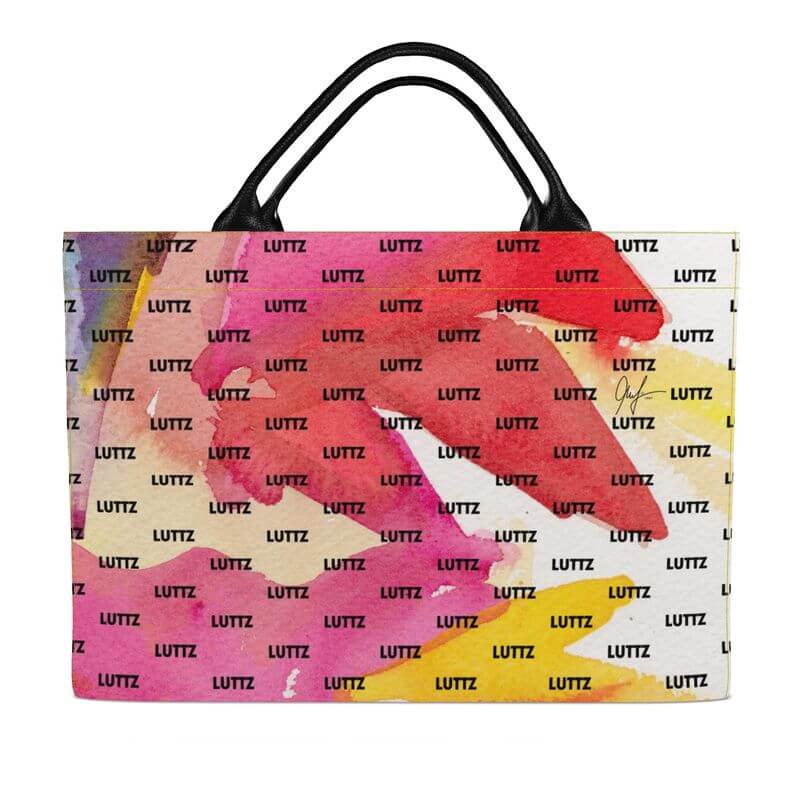 Colorful MARSEILLE ENERGY bag from LUTTZ, featuring unique Mediterranean design and leather handles, perfect for beach outings.