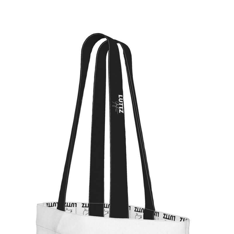 Close-up of black and white straps of the UNIQUA tote bag by LUTTZ, showcasing luxury minimalist design and unique fabric.