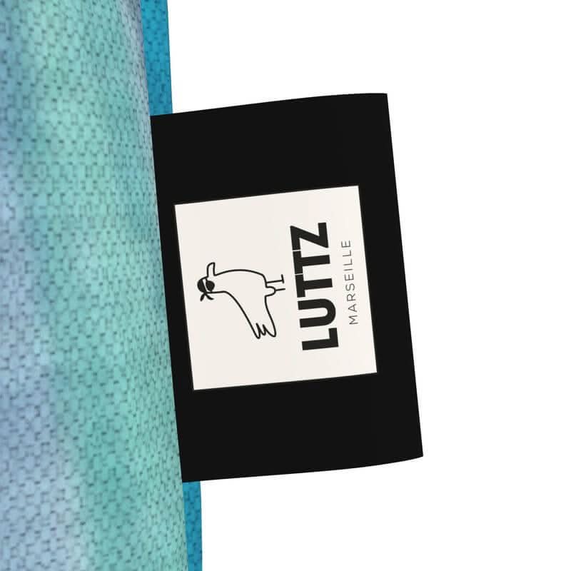 LUTTZ logo on a designer tote bag, showcasing unique Mediterranean fabric design from Marseille.
