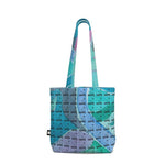 Luxury tote bag from LUTTZ featuring a unique Mediterranean fabric design, inspired by the south of France.