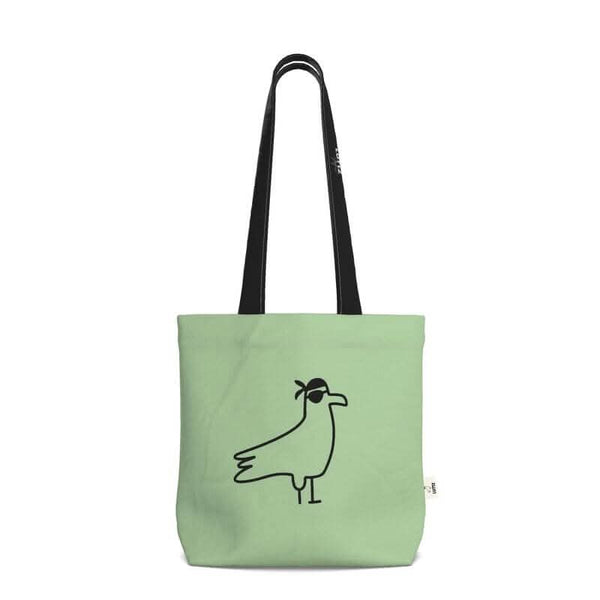 Green tote bag with minimalist bird design, elegant and unique, perfect for daily use.