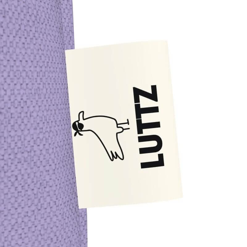 LUTTZ brand label on a lavender tote bag, showcasing unique minimalist design, inspired by Mediterranean elegance.