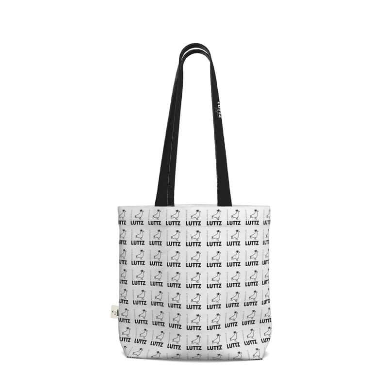 Elegant black and white tote bag from LUTTZ featuring unique fabric design, minimalist style, and inspired by the South of France.