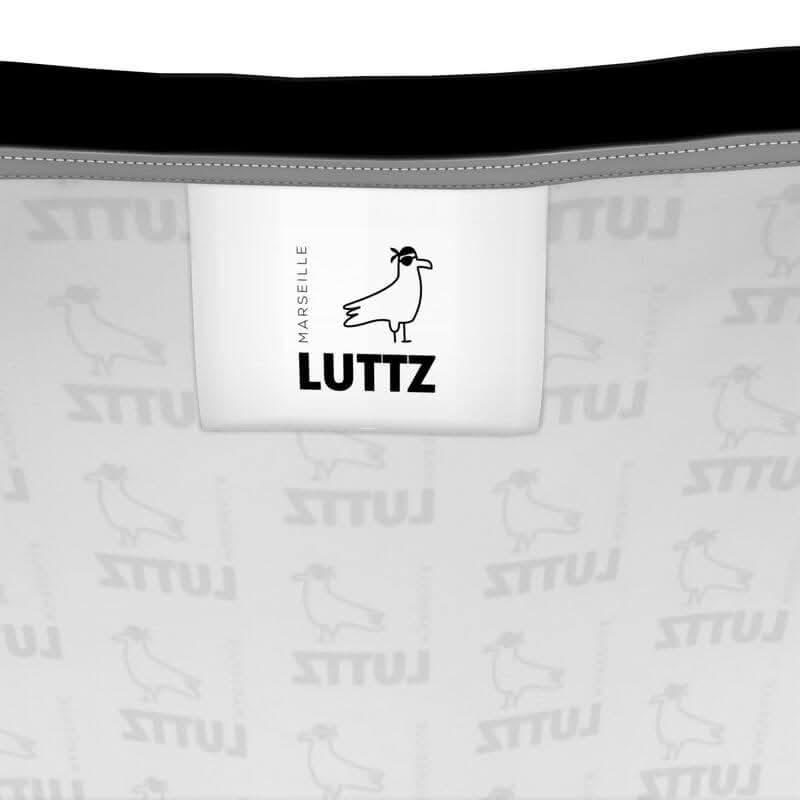 LUTTZ brand label with a minimalist design, showcasing the luxury and elegance of Marseille-inspired fashion.