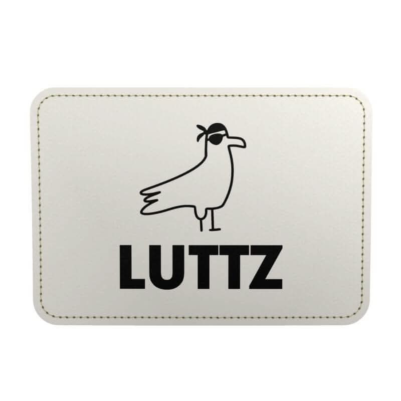 LUTTZ brand logo featuring a stylized seagull with sunglasses, highlighting Mediterranean-inspired design.
