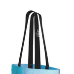 BREEZE daily tote bag from UNIQUA series by LUTTZ featuring blue cotton denim and stylish black straps.