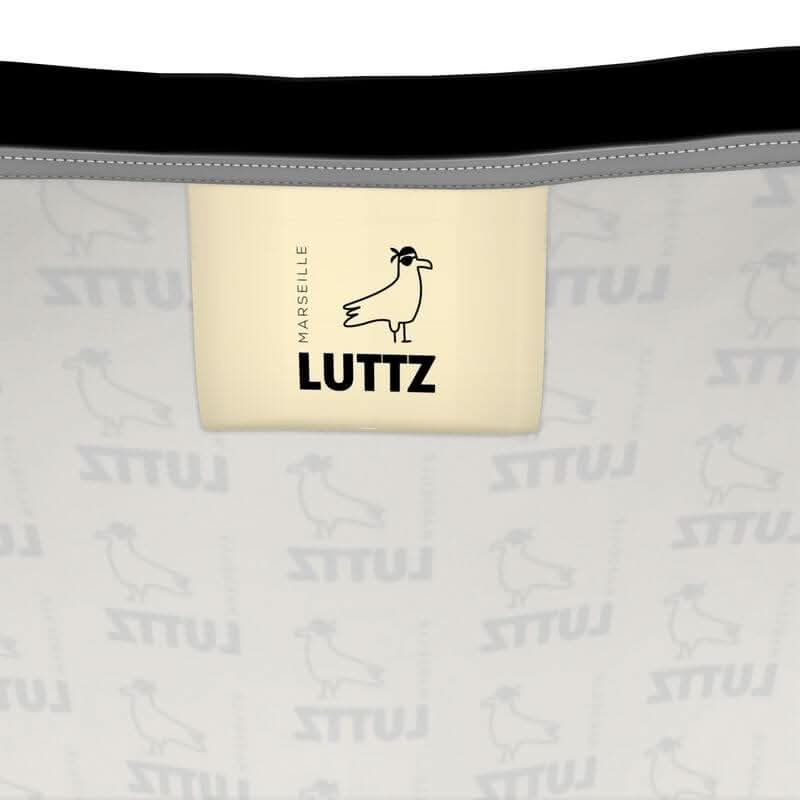 LUTTZ logo on unique fabric design from Marseille, highlighting the brand's Mediterranean elegance and minimalist style.