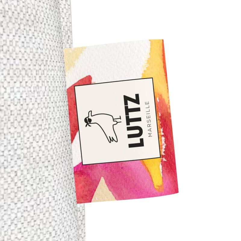 LUTTZ Marseille label showcasing vibrant Mediterranean-inspired design on a luxury tote bag.