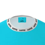 Close-up of LUTTZ oversized t-shirt collar, featuring a unique light blue design and branded neckline.