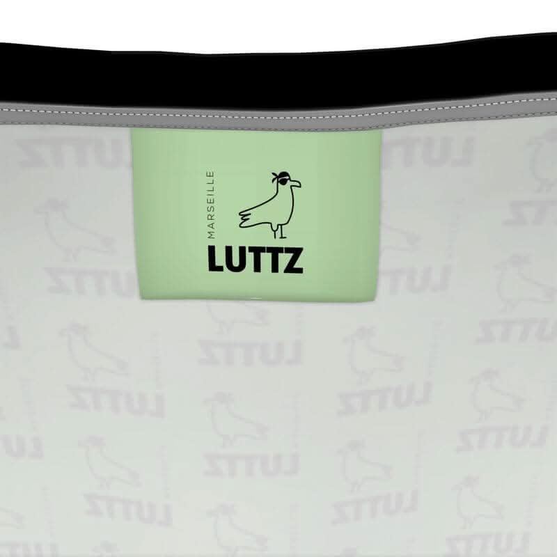 LUTTZ label in green on a designer tank top, showcasing unique Mediterranean style from Marseille.