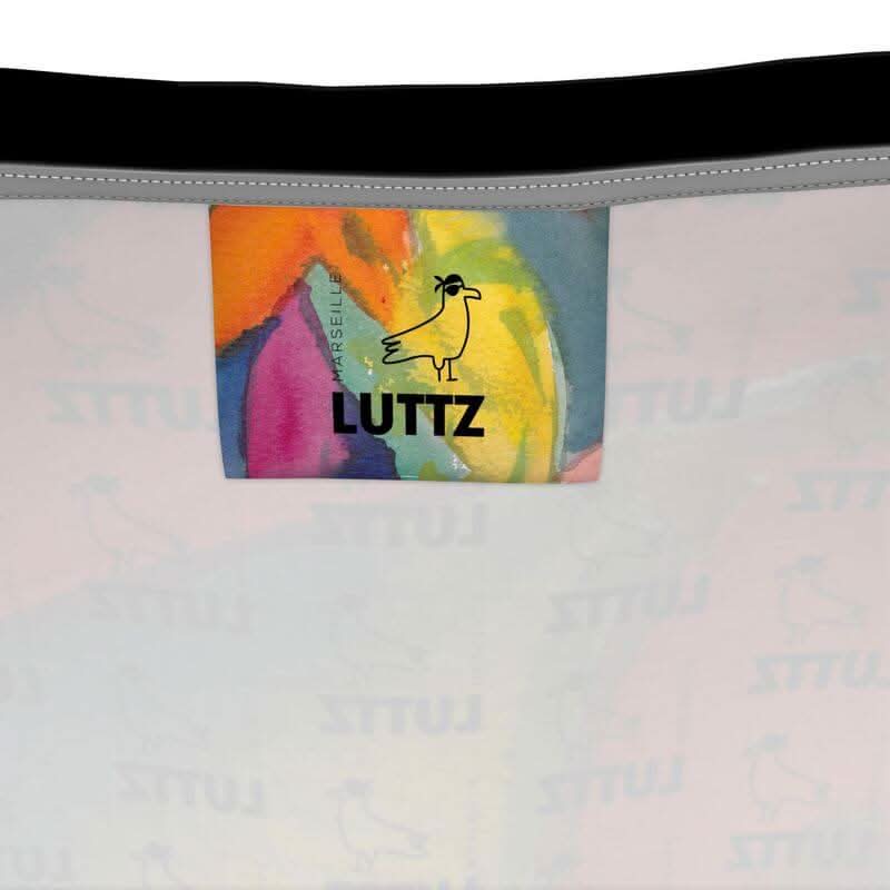 LUTTZ tank top label featuring a unique, colorful design like an abstract painting, highlighting luxury and exceptional craftsmanship.