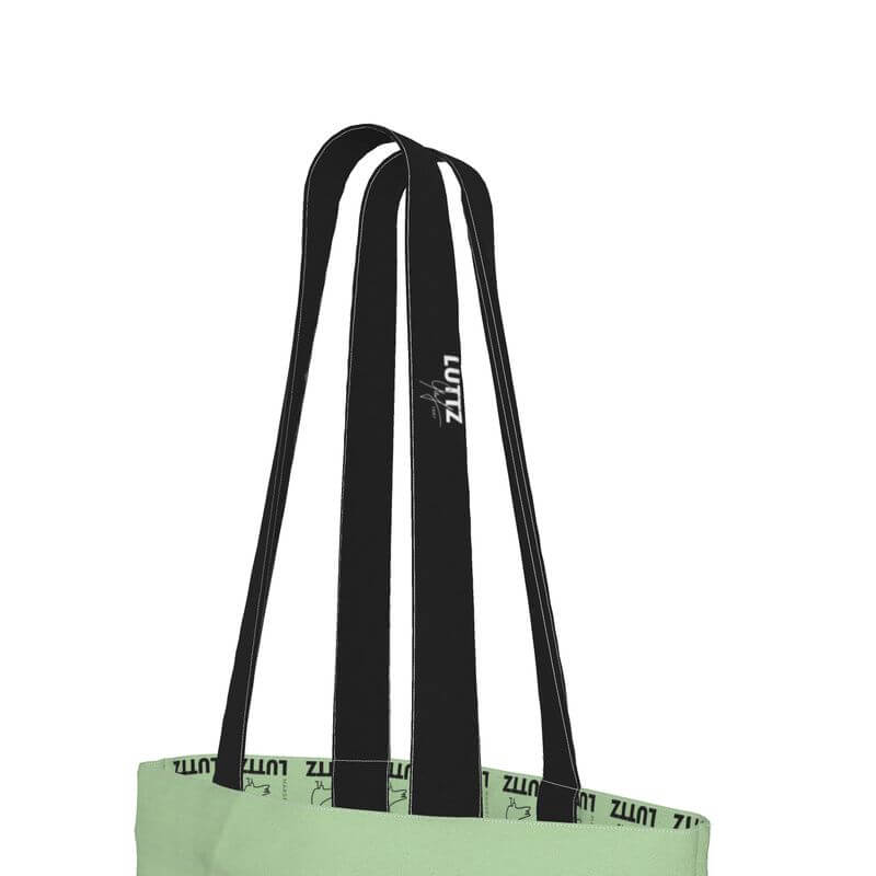 Elegant olive green tote bag handles featuring black designer straps from LUTTZ, ideal for everyday use.