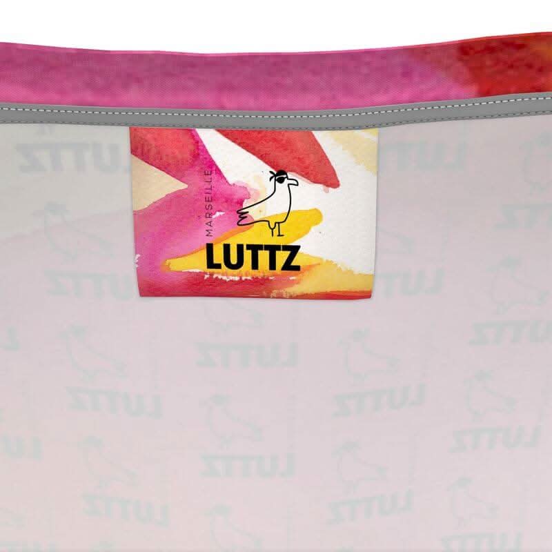 LUTTZ label on a tank top featuring unique mediterranean abstract fabric design, inspired by Marseille, South of France.