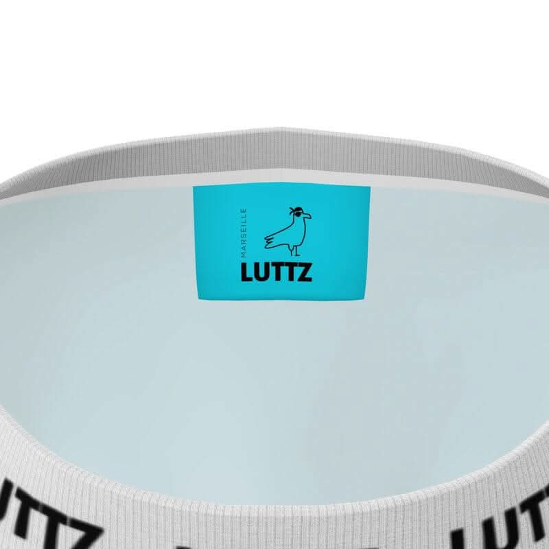 Close-up of the LUTTZ logo and label inside an oversize t-shirt, showcasing its unique design and casual style.