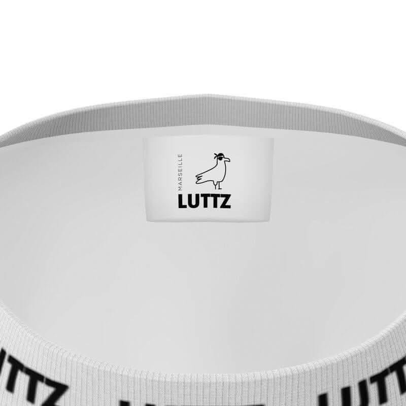 Interior view of LUTTZ oversized t-shirt showcasing luxury branding and unique design details.
