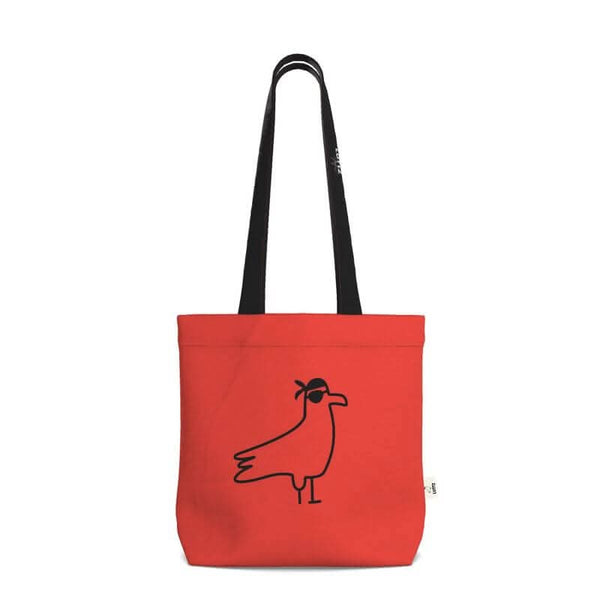 Unique red tote bag with minimalist bird design, perfect for casual outings and inspired by Mediterranean aesthetics.