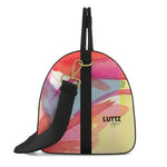 LUTTZ PRIMAVERA LARGE leather bag in vibrant abstract design, a luxury art object for unique style and exceptional travel.