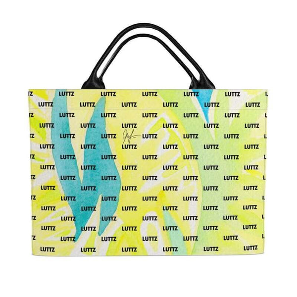 Luxury LUTTZ bag with unique Mediterranean fabric design, a vibrant beach bag inspired by the south of France.