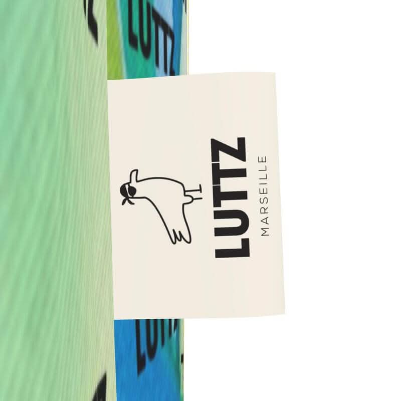 Close-up of LUTTZ logo on colorful bag, showcasing Mediterranean design from Marseille, a joyful and unique brand.