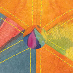 Close-up of the hand-designed colorful panels on a luxury baseball cap from Marseille, inspired by Mediterranean art.