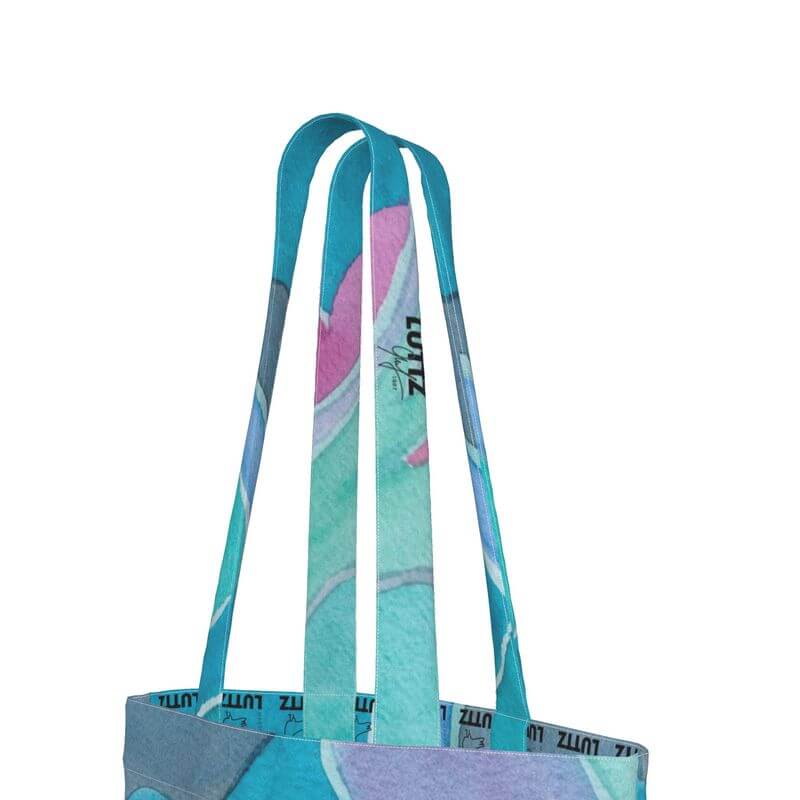 Close-up of the unique strap design of the contemporary UNIQUA tote bag, showcasing Mediterranean fabric patterns.