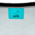 Inside label of LUTTZ bag showcasing unique fabric design and brand name, inspired by Mediterranean elegance.