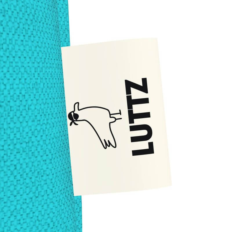 LUTTZ brand label on turquoise tote bag showcasing unique fabric design inspired by the Mediterranean.