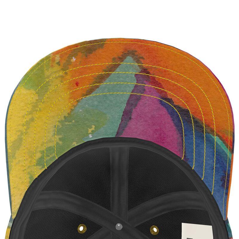 Unique baseball cap with Mediterranean fabric design, showcasing colorful artwork, inspired by the South of France.